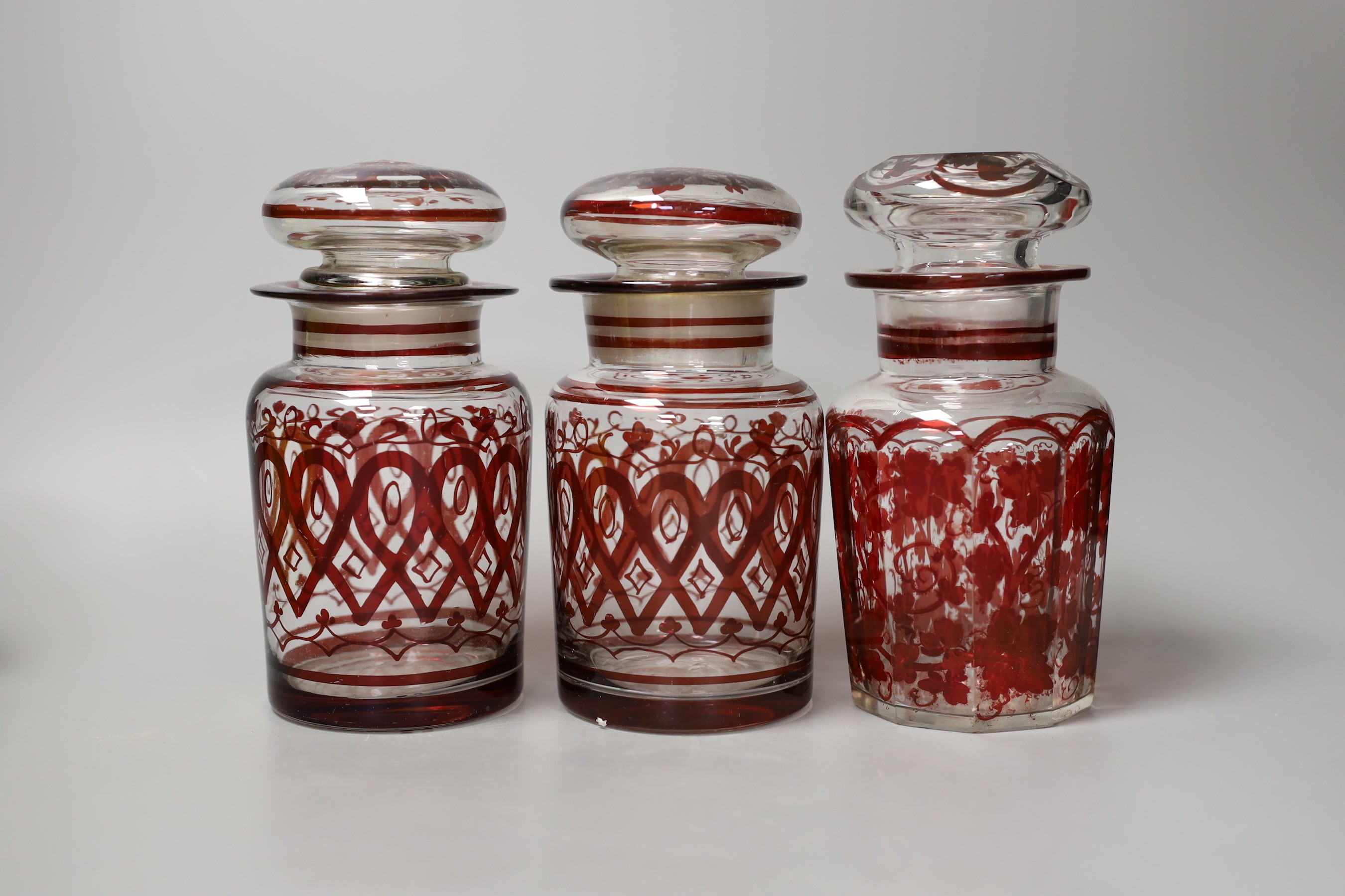 A pair of ruby overlaid goblets, three ruby and glass pickle jars and other sundry glassware